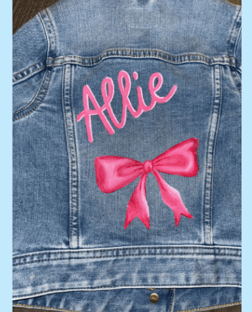 Denim jacket hand-painted with the name Allie and a bow